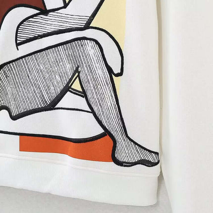 Embroidered Pattern Hoodie – Loose Fit showcasing artistic design with a white background and stylish illustrated detail.