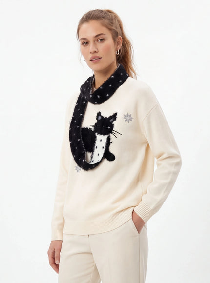 Close-up of Apricot cute cat knit sweater pattern fabric