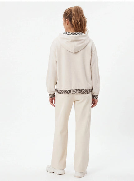 Close-up of gray animal pattern patchwork perforated sweatshirt fabric