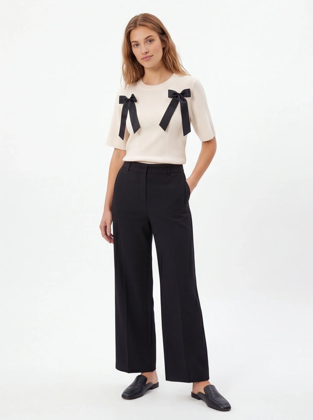 Close-up of White bow detail ribbed tee fabric
