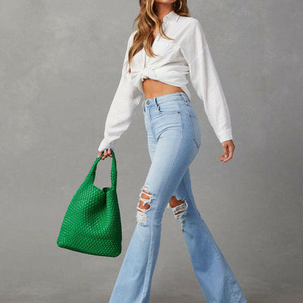 Women's washed ripped high-waisted denim wide-leg trousers at €51.99