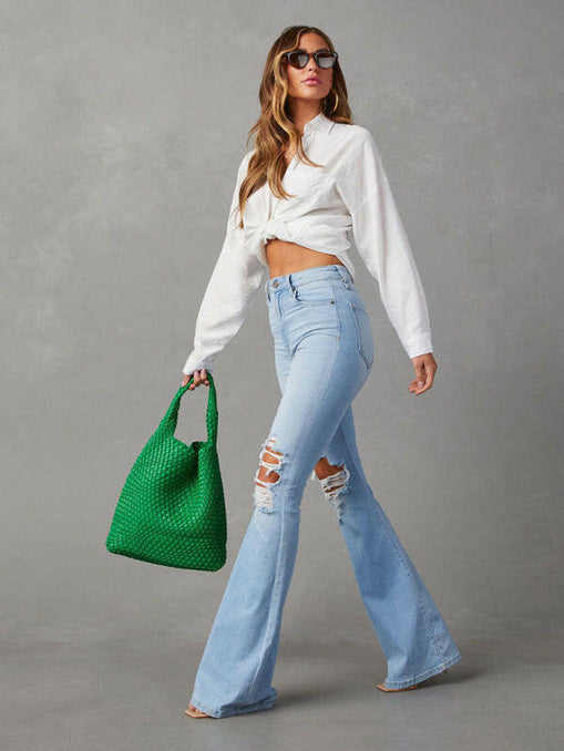 Women's washed ripped high-waisted denim wide-leg trousers at €51.99